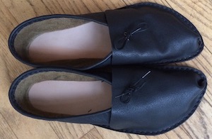 A pair dark brown shoes