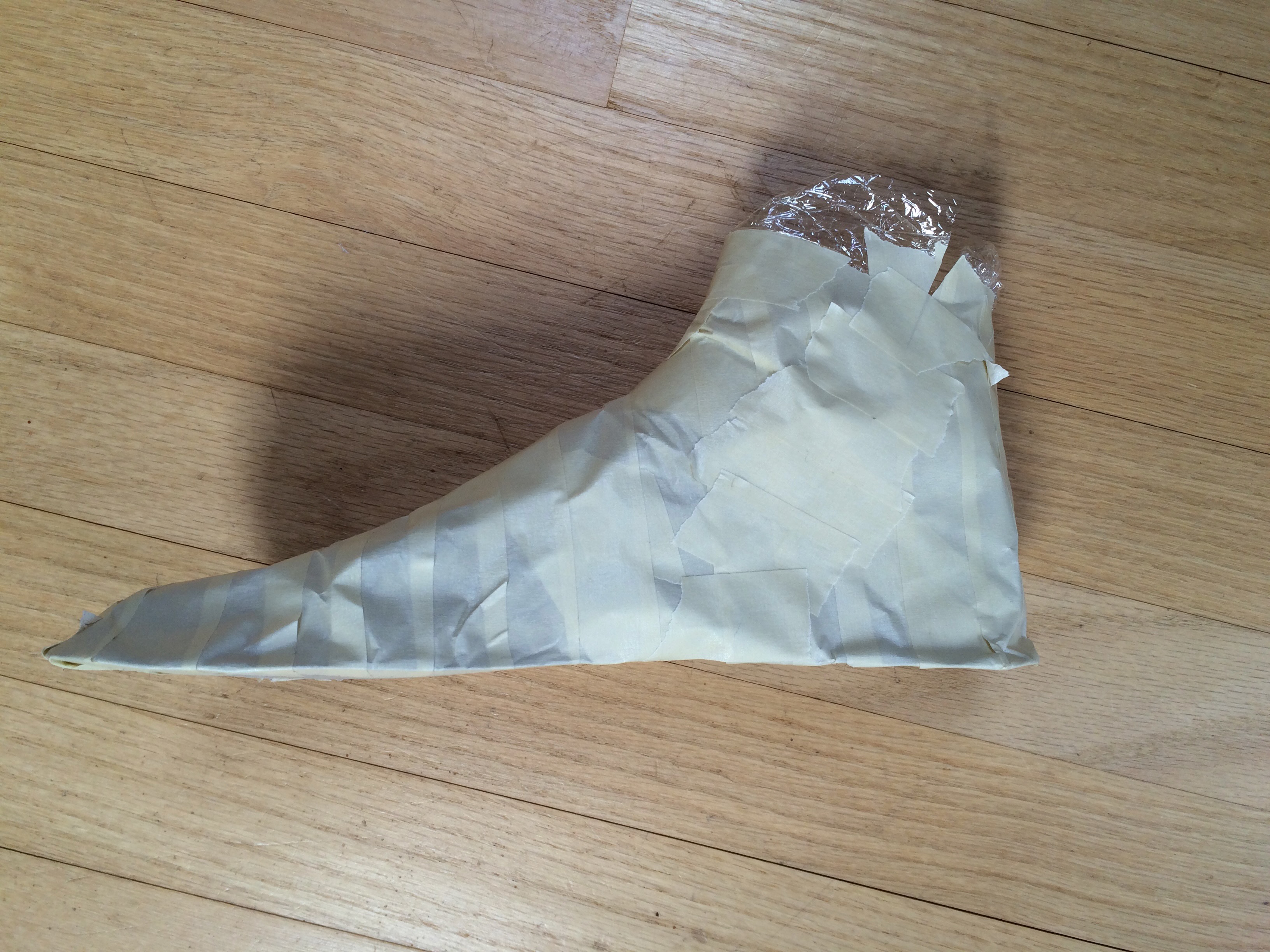 A masking tape cast of a foot